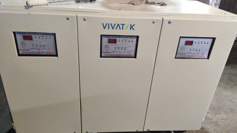 Industrial three phase servo stabilizer installed in manufacturing factory for cnc machines, industrial motors, compressors, and automation systems