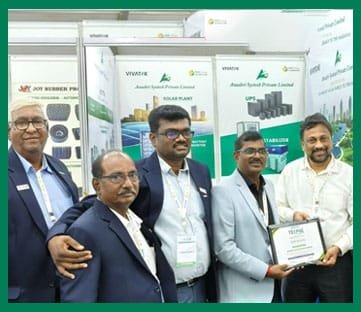 Anushri Systech team receiving recognition at an industrial exhibition